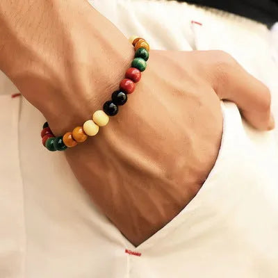 Natural stone bead bracelet with lava stones on wrist, showing ethnic unisex design.
