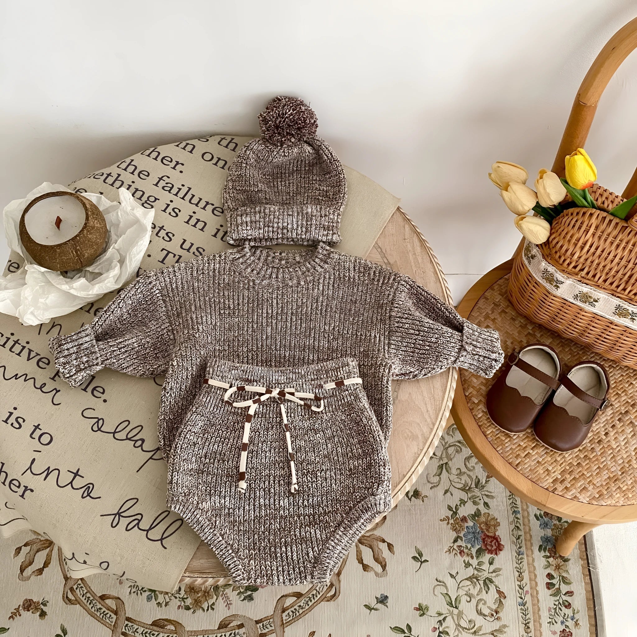 Dark brown knitted baby girl three-piece set with removable fur ball hat, blouse, and shorts