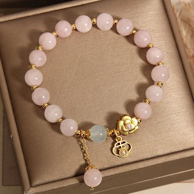 Women's pink crystal flower bracelet with floral pattern design and clasp closure