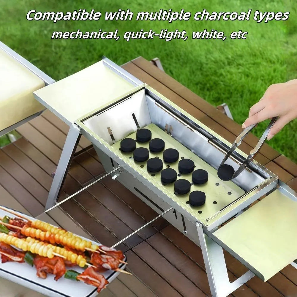 Small foldable portable steel charcoal grill for outdoor use.
