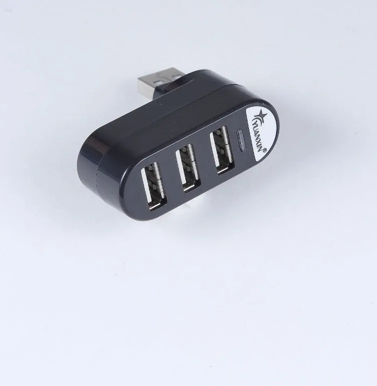 Black and white USB hub with four USB 2.0 ports for computer expansion
