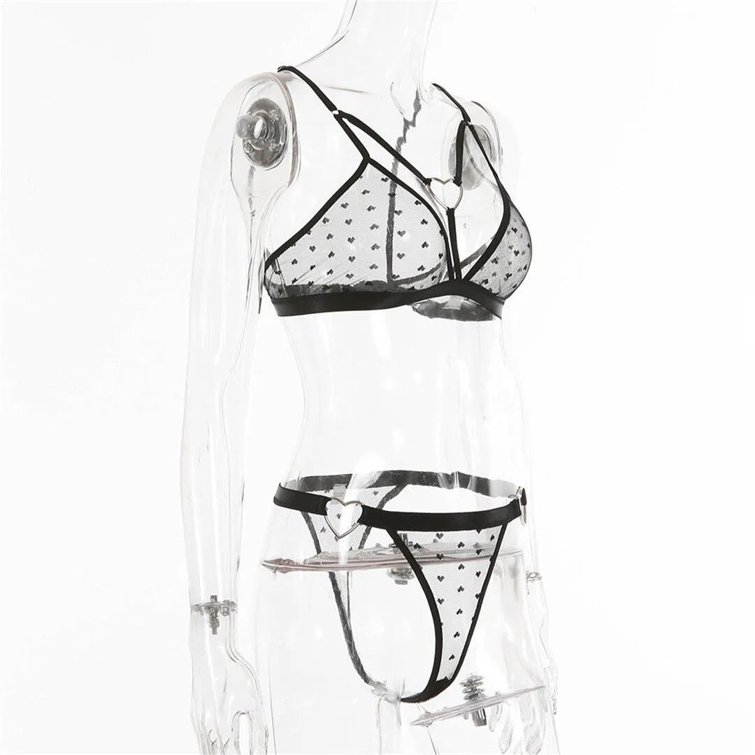 Ladies' black mesh spandex two-piece athletic set with matching top and trousers.