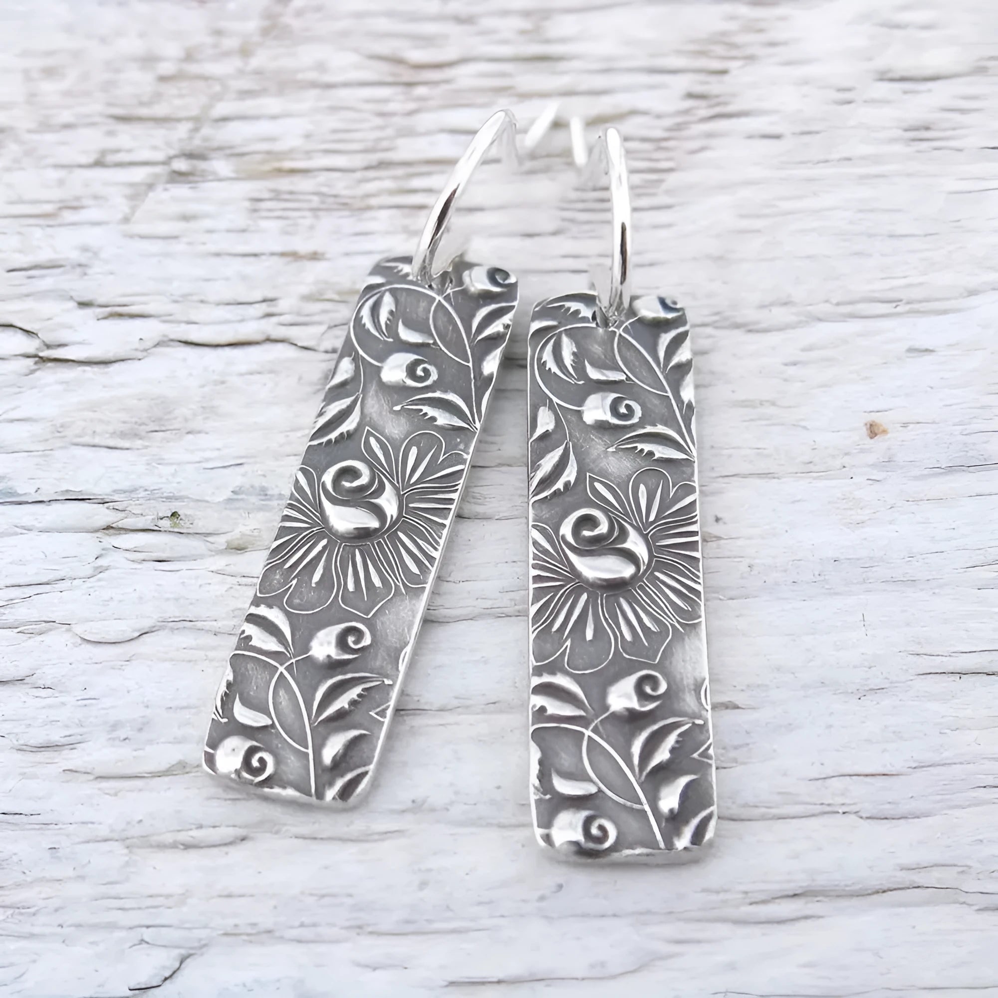 Silver geometric long earrings with carved vine patterns on zinc alloy