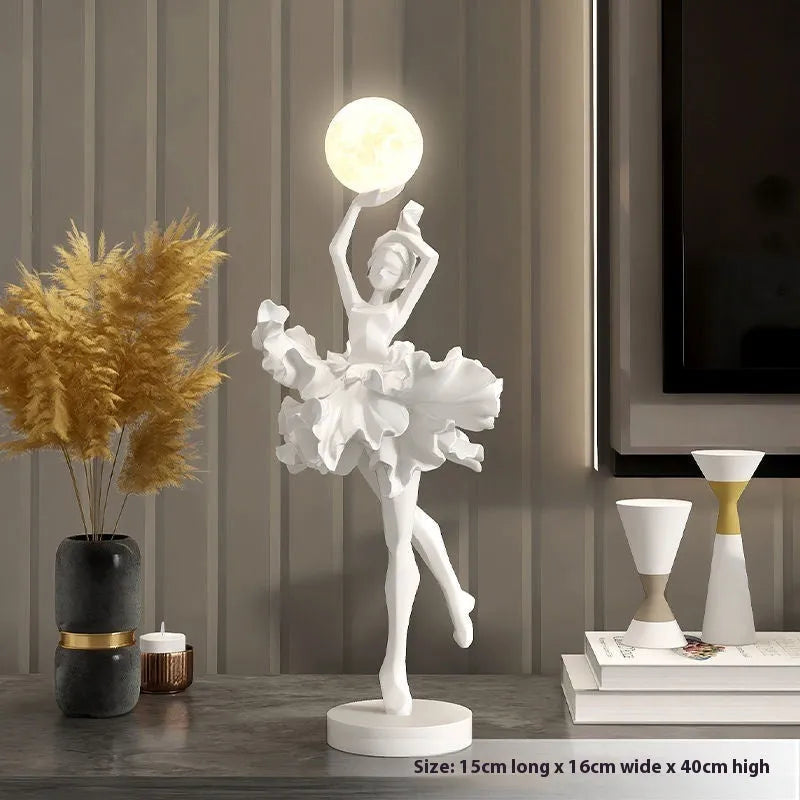 Small modern night lamp ornament in resin showing colour options: black gold, white, pink, and light blue.