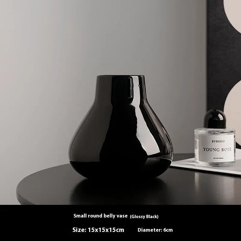 Round belly ceramic vase in black or white with optional artificial flowers arrangement