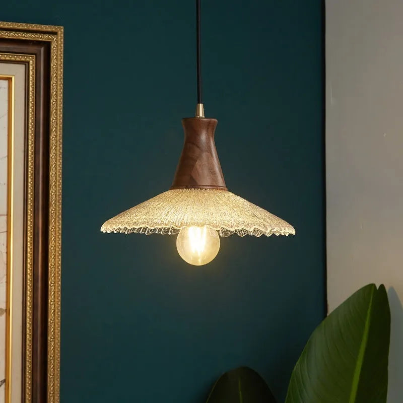 Retro wooden chandelier with glass shade and brass fittings for ceiling lighting.