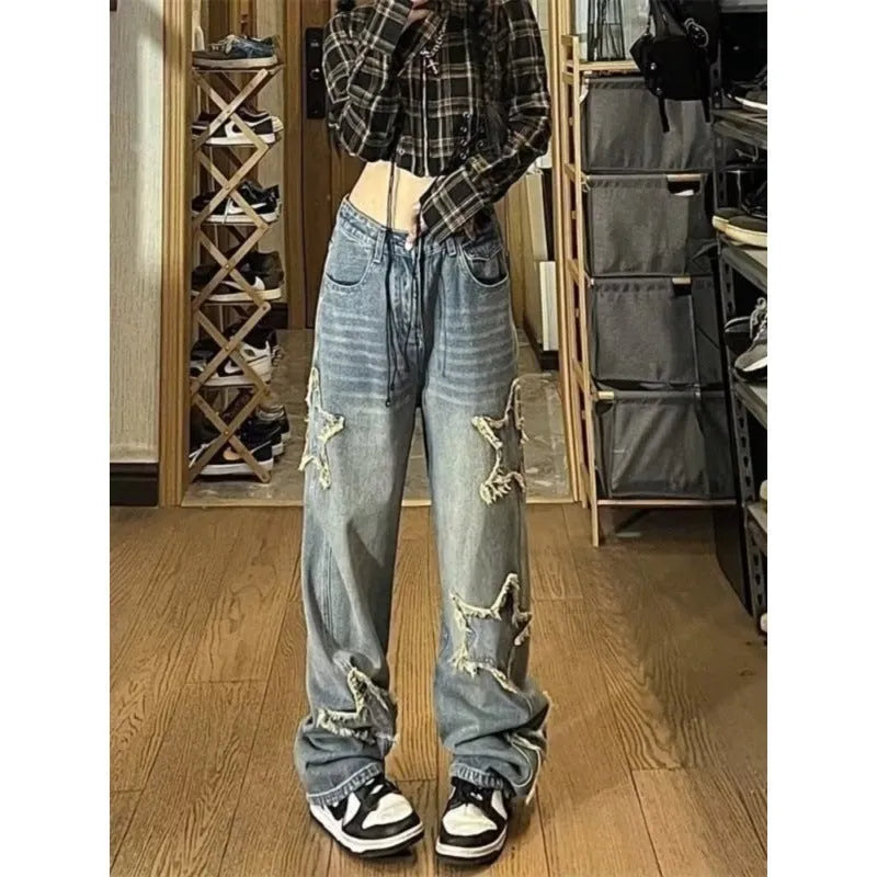 Blue high-waist wide-leg denim jeans with straight-leg fit on hanger