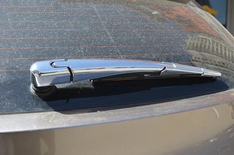 Four silvery ABS plastic rear window wiper cover trims for a 2010 Hyundai.