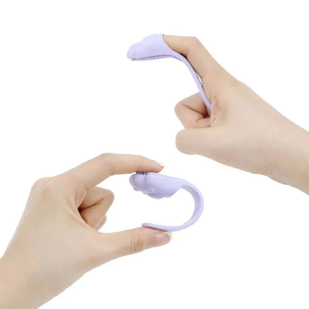 Silicone finger cover toothbrush for dogs and cats in pink, purple, yellow, and white.