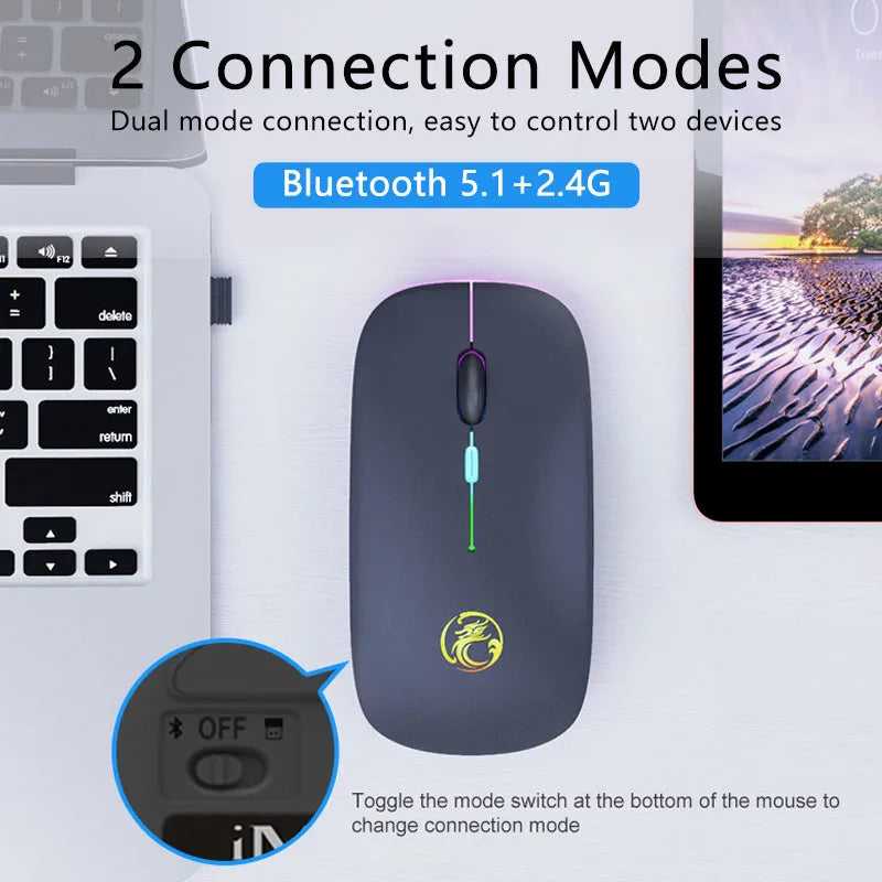 Black and white dual-mode wireless silent mouse with luminous charging scroll wheel on a desk.