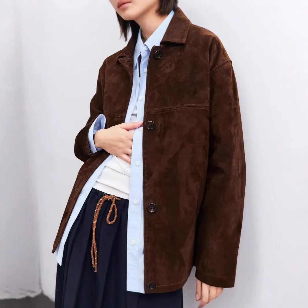 Women's Caramel Mocha cashmere coat with Peter Pan collar and leather stitching in a loose retro fit.
