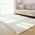 Solid colour plush rectangle carpet with soft velvet pile and non-slip dotted backing.