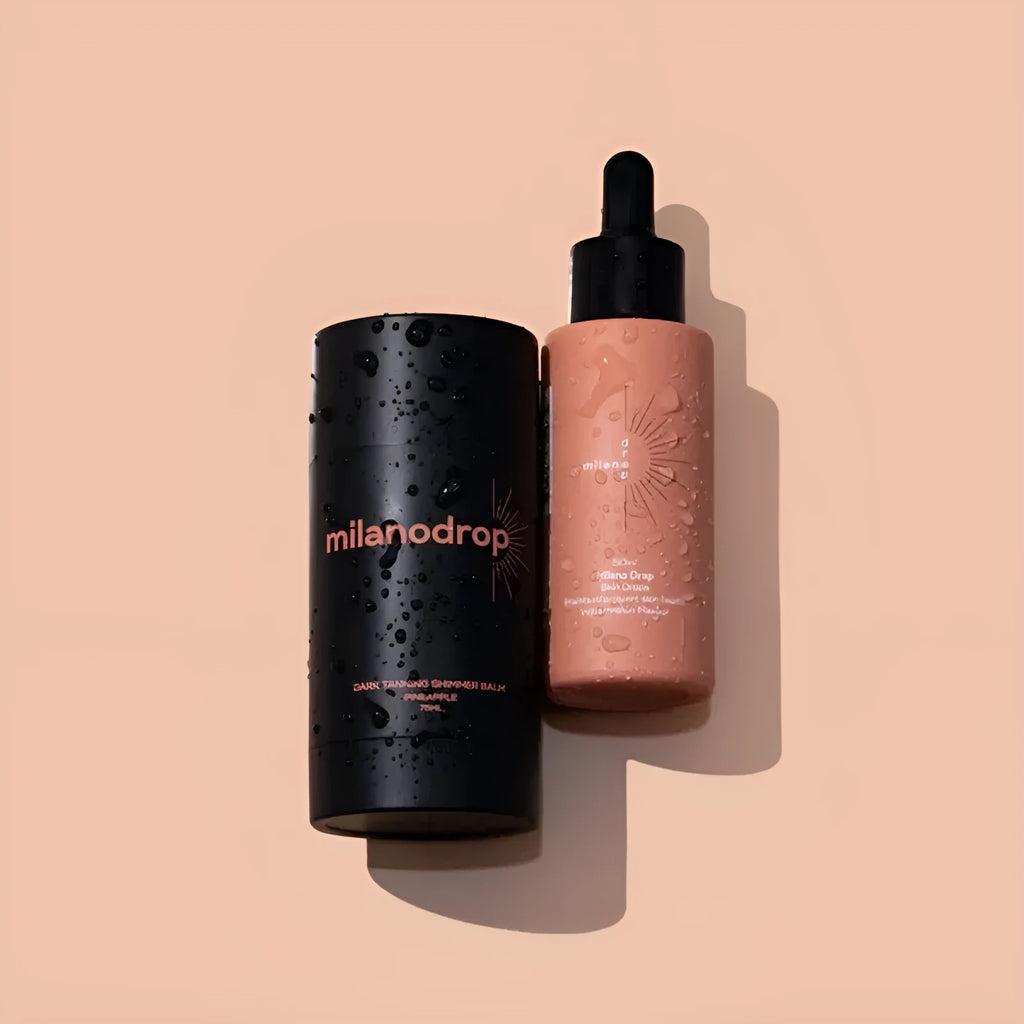 Matte tanning black liquid bottle and glitter cream tube for body care application.