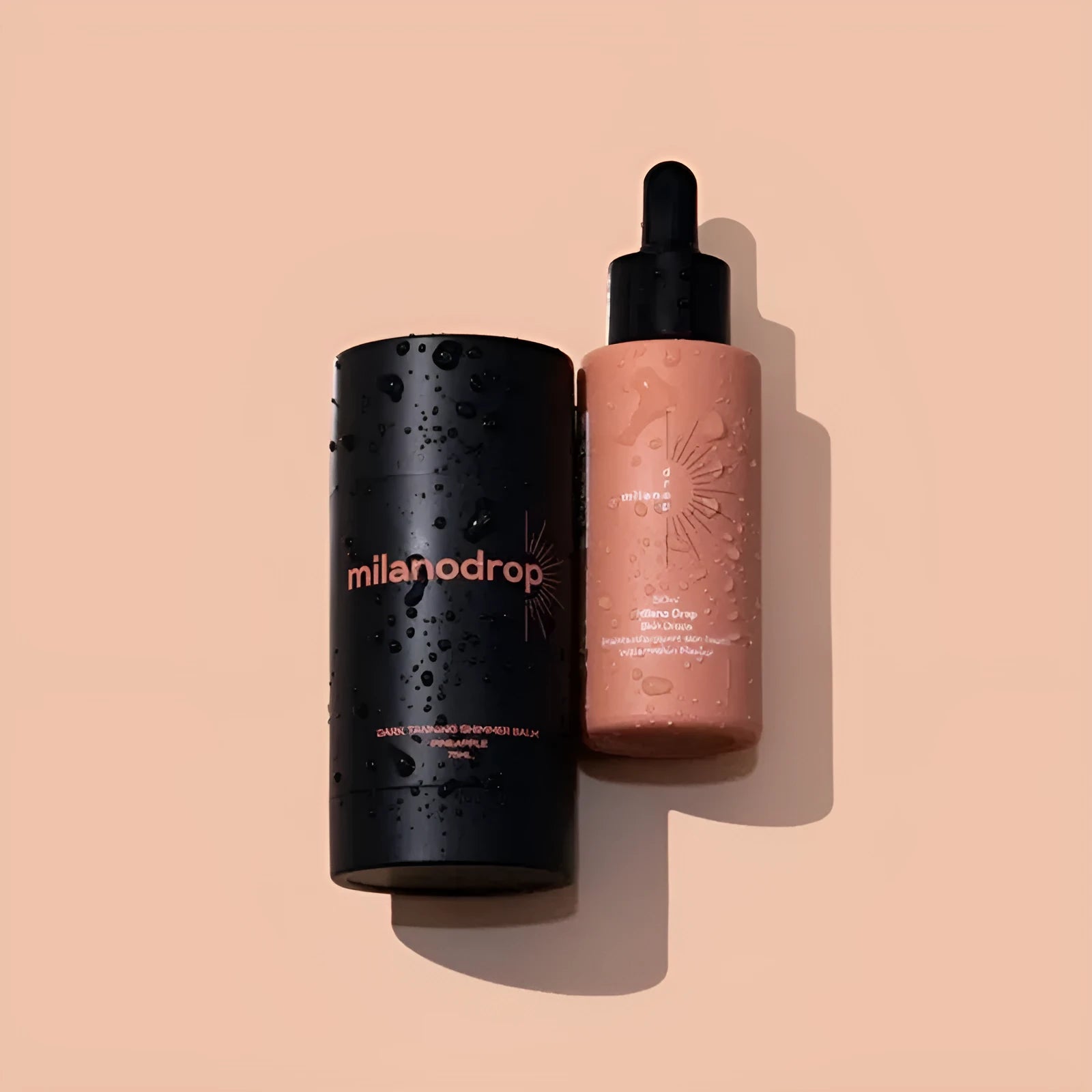 Matte tanning black liquid bottle and glitter cream tube for body care application.