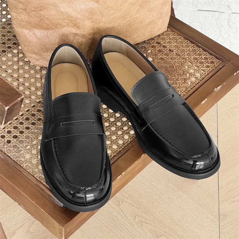 Men's black slip-on Derby leather shoes with a Microfiber upper and rubber sole.