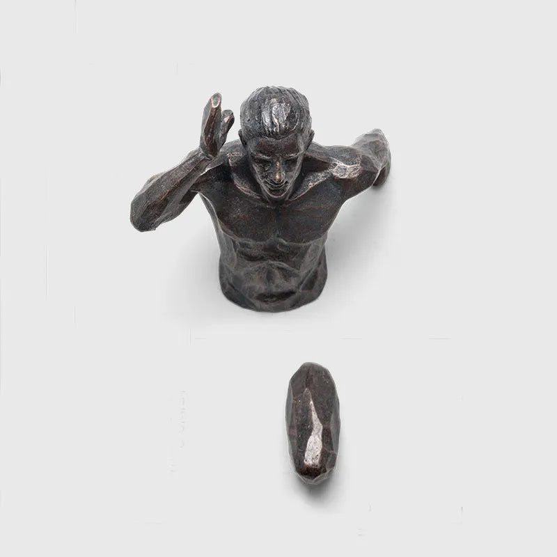 Modern resin character wall hanging in a choice of left or right facing design with copper, gold, or silver finish.
