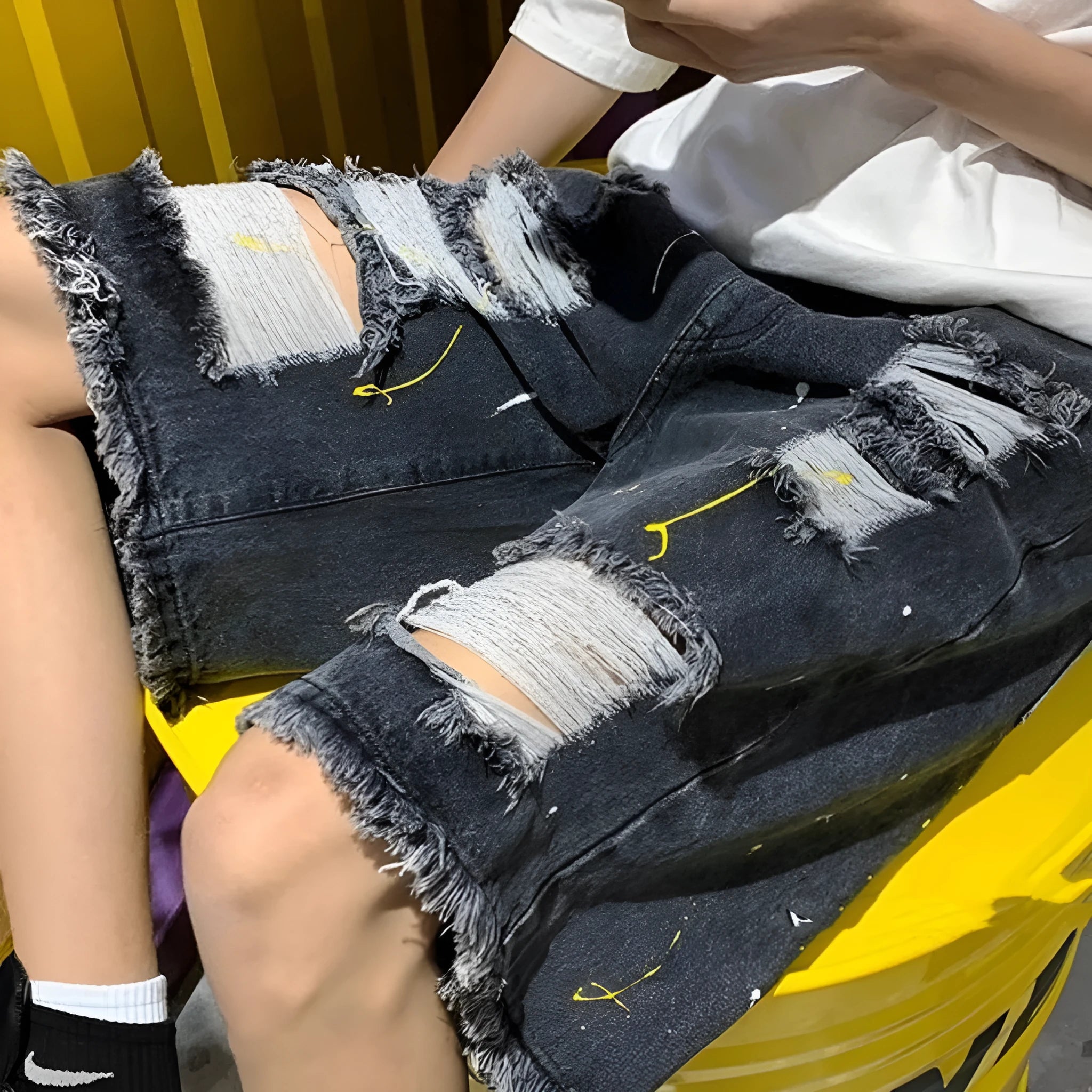 Men's water washed hole denim shorts in loose fit street style