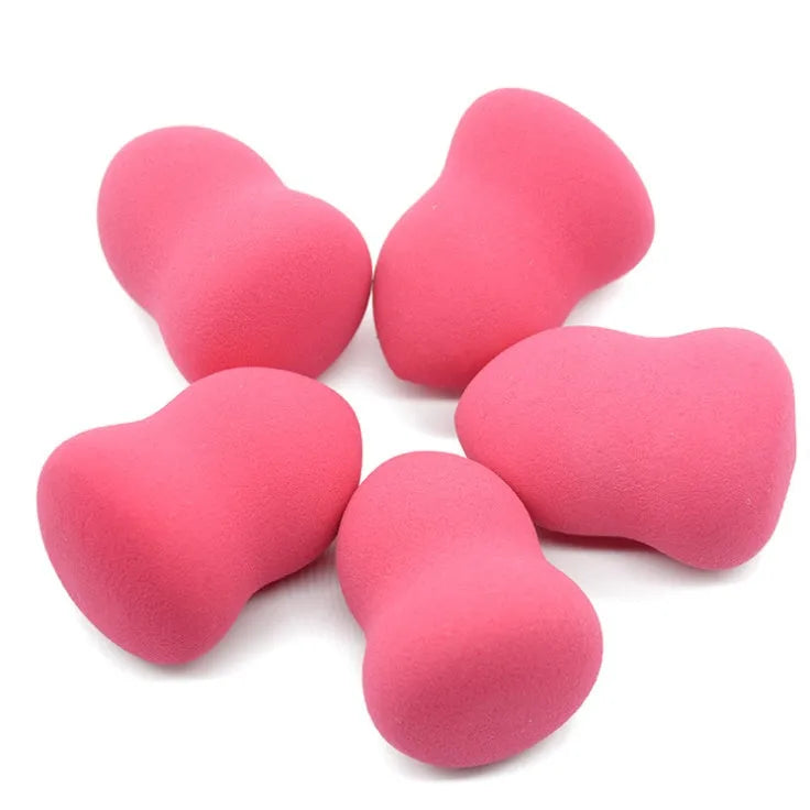 Pink non-latex makeup foundation sponge for wet or dry application, shown next to a ruler showing its 4cm size.