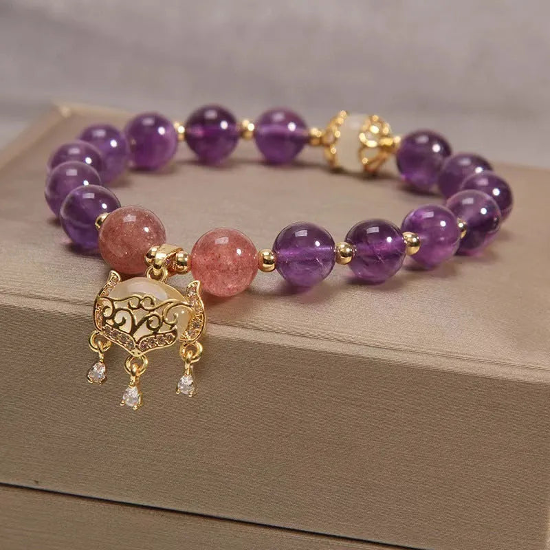 Handmade copper bracelet with natural amethyst crystal and gold longevity lock charm