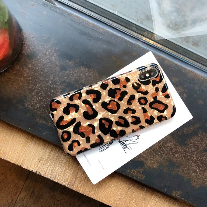 Leopard print patterned silicone phone case for iPhone on a table