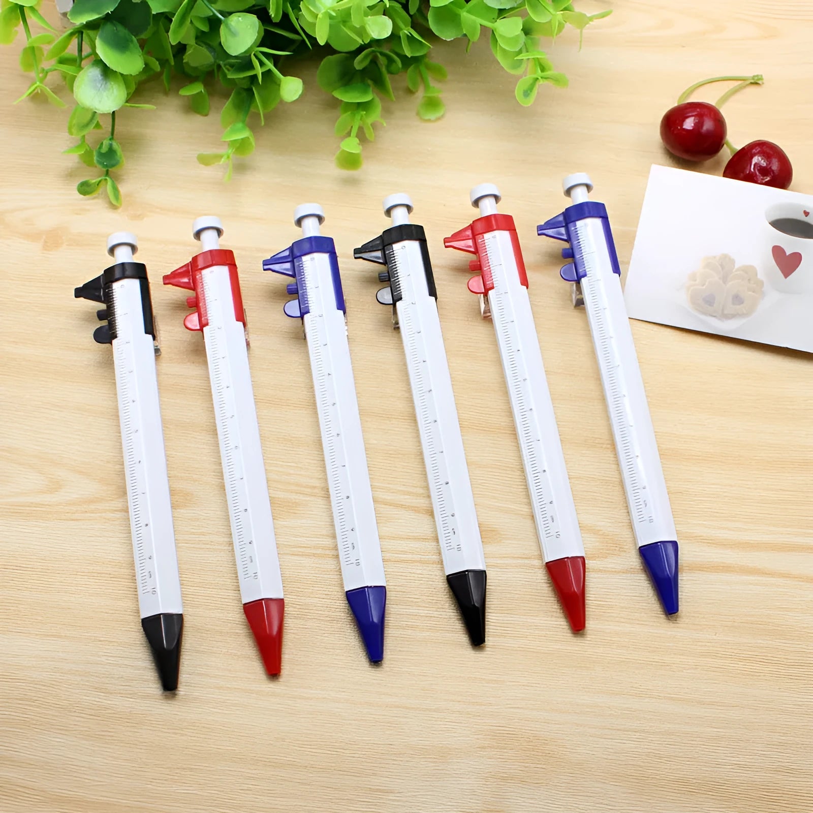 Orange multifunction pen with vernier caliper and 0.5mm ballpoint tip measuring 15cm long