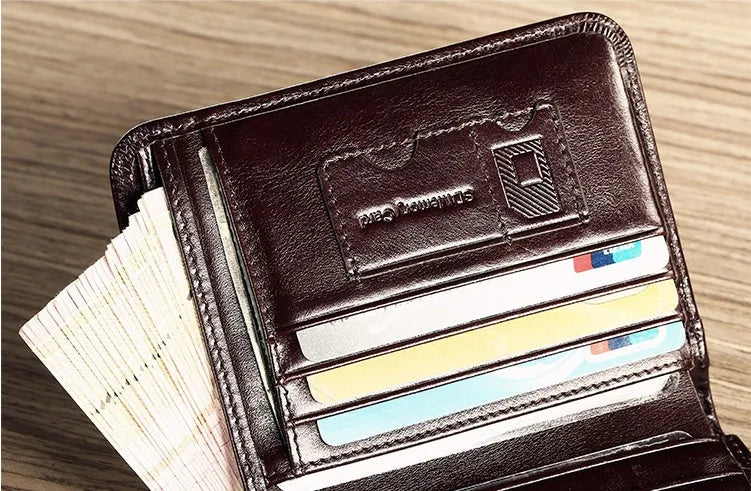 Men's brown leather bifold wallet open to show multiple card slots, a cash compartment, and a coin pocket.