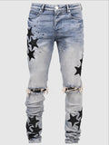 Men's slim blue jeans with embroidery detail on the leg, showing a mid-waist fit.