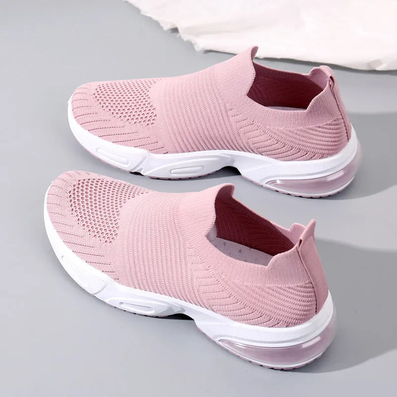 Slip-on breathable sock shoes in black, pink, khaki, and white with mesh lining and PVC sole.