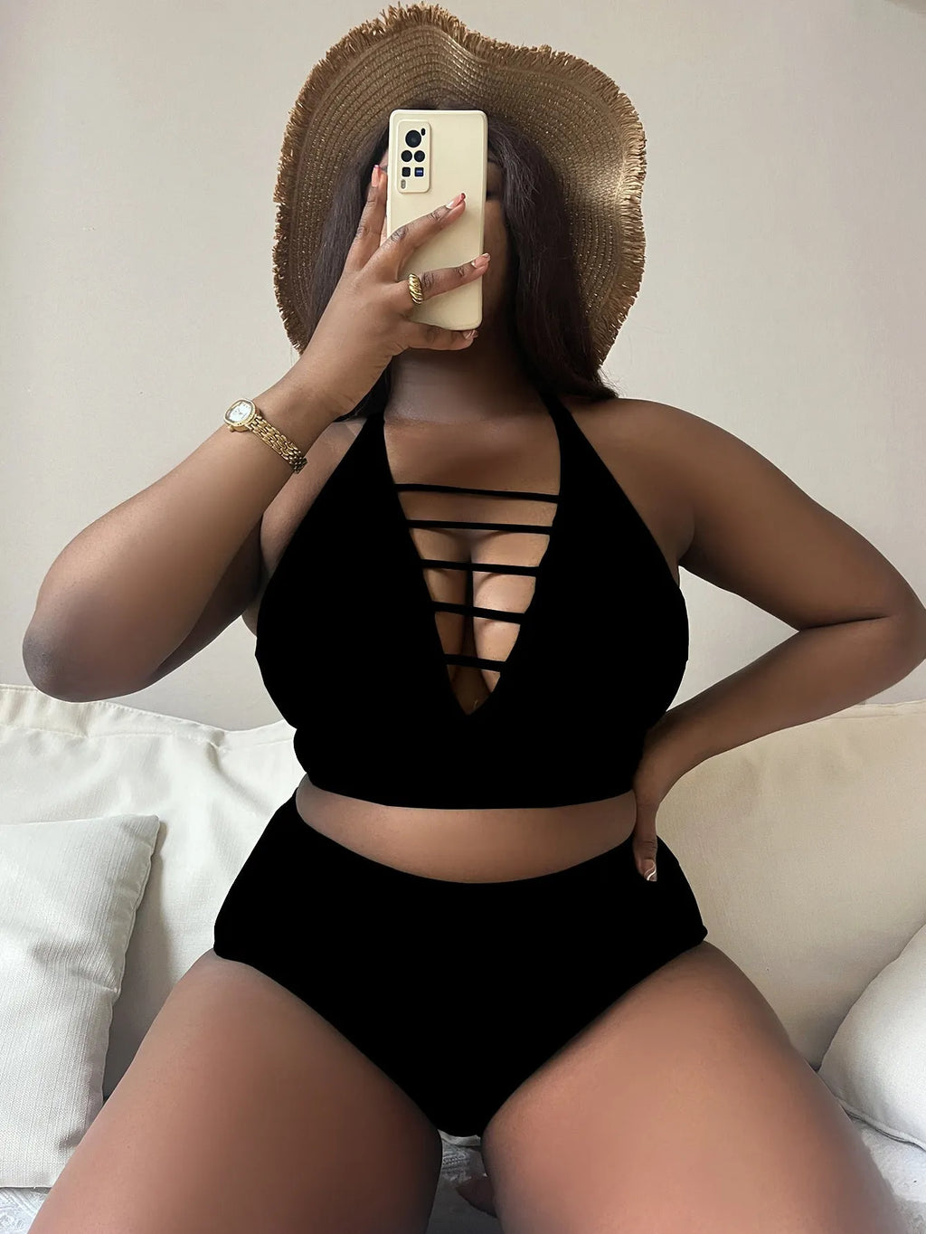 Plus size black halter bikini set with adjustable cross straps and high-waisted briefs.