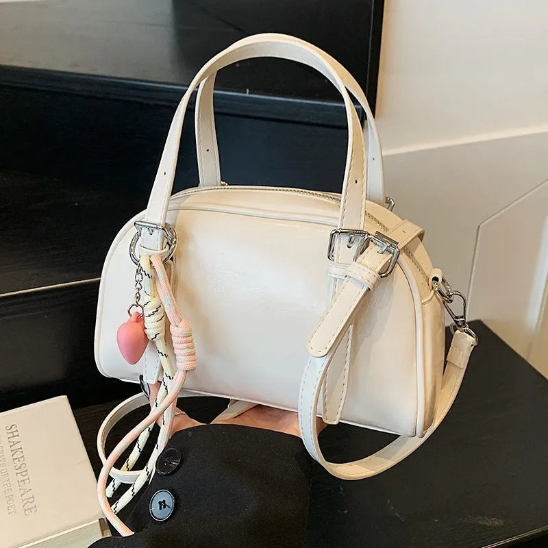 Korean-style women's shell shoulder bag in square shape with optional pendant attachment