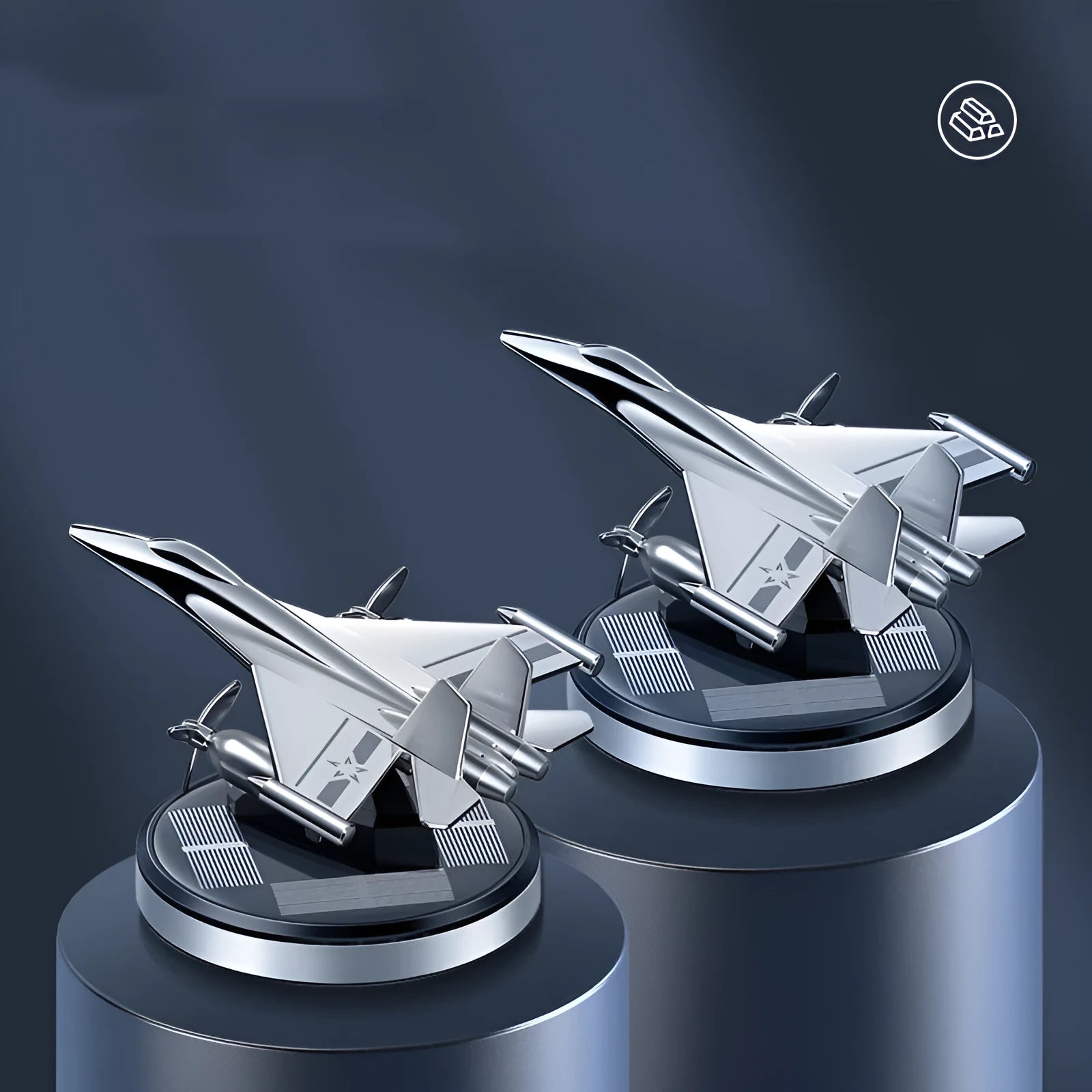Silver solar-powered rotating fighter jet perfume ornament on a surface.