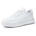 Women's white leather lace-up flat casual shoes shown from the side.