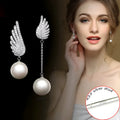 Silver angel wing earrings with diamond-treated metal and gold-plated inlaid gemstones in platinum colour