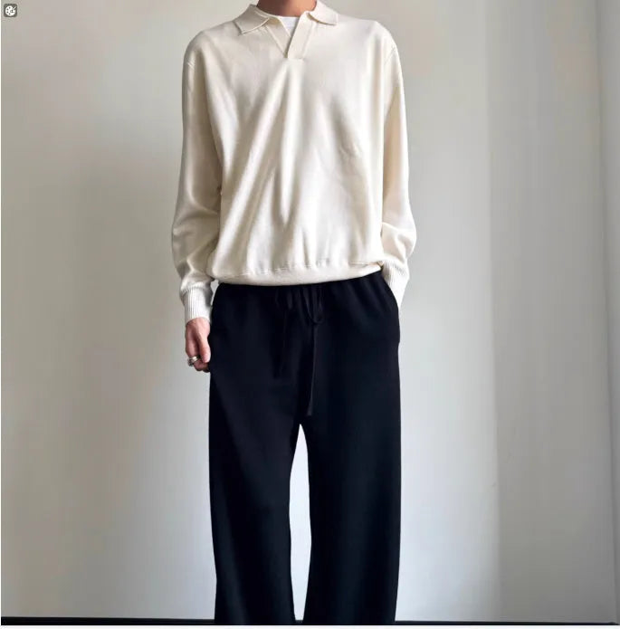 Pure wool polo sweater with lapel collar in loose fit, shown in navy blue colour.