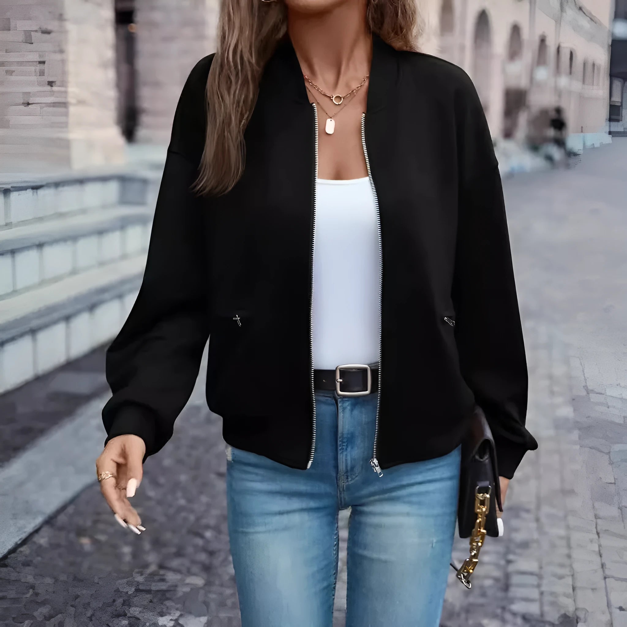 Black women's casual zip-up jacket with long sleeves and faux pockets