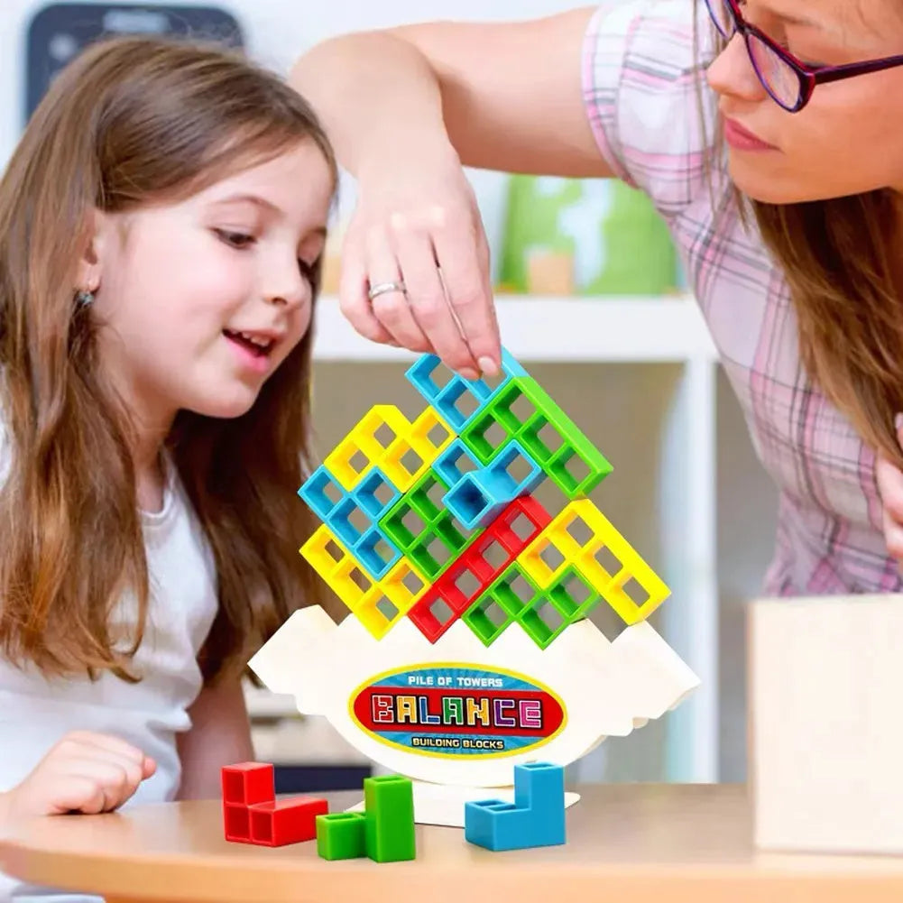 Plastic balance stacking game with colourful blocks on a chassis
