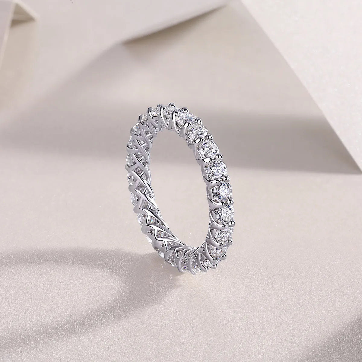 Rose moissanite wedding ring in platinum-plated S925 silver, on display with GRA certificate and gift box