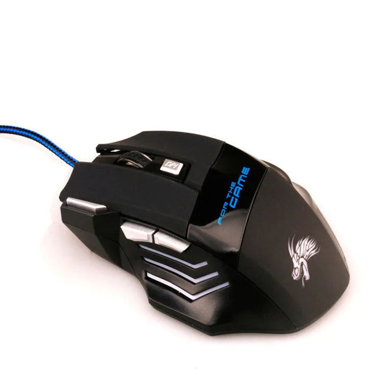 Black wired USB gaming mouse with Tyrannosaurus Rex design, six buttons, and colourful LED light on a desk