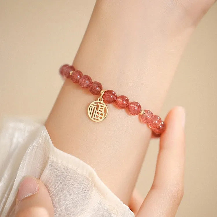 Women's strawberry quartz blessing card bracelet with glass construction and universal wrist size
