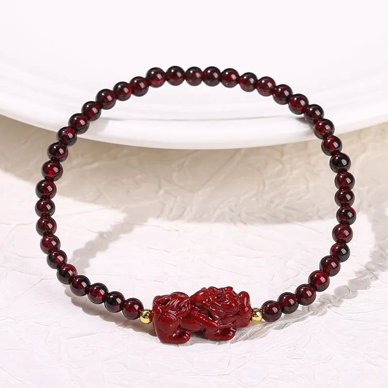 A square geometric bracelet for women made from natural Garnet and Strawberry Quartz with a carved Pixiu charm.