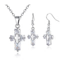 Copper cross ornament set with a 1.2 x 2.2 cm pendant and 3.3 x 1.2 cm studs in gold or silver plated finish