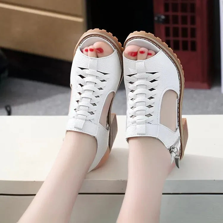 Women's black retro sandals with a side zipper and a mid-heel.