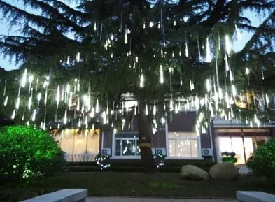 Waterproof LED meteor shower rain lights with multicolour effects in outdoor garden setting