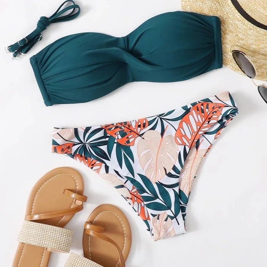Split push up hard bag bikini swimsuit with matching briefs in multiple colours on a mannequin.