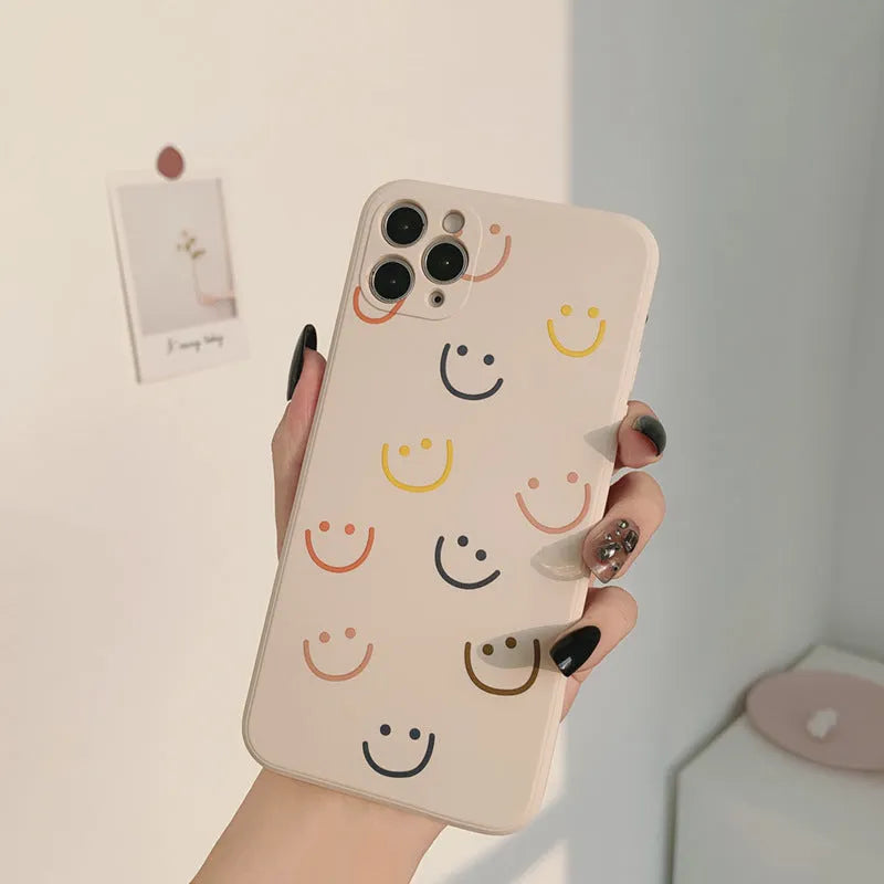 Silicone TPU phone case with painted smiley design for iPhone, shown in rainbow colour.