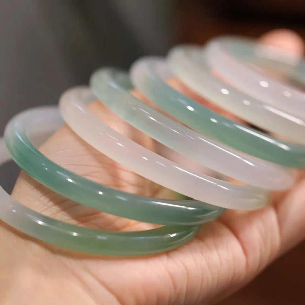 Chalcedony jade bracelet showing natural stone patterning with size measurement indicators