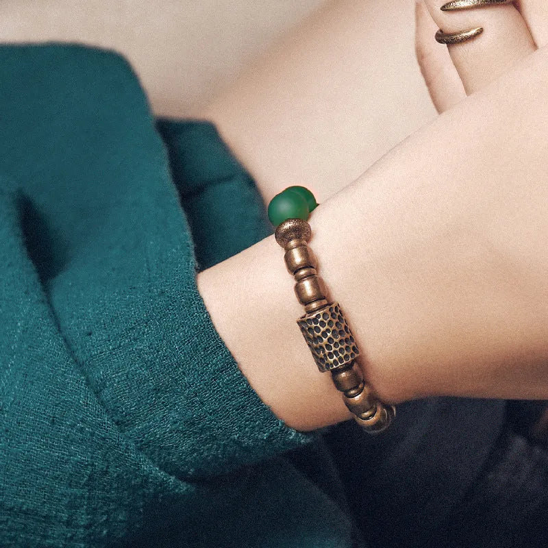 Retro ethnic style couples bracelet with natural green agate beads shown on a wrist.