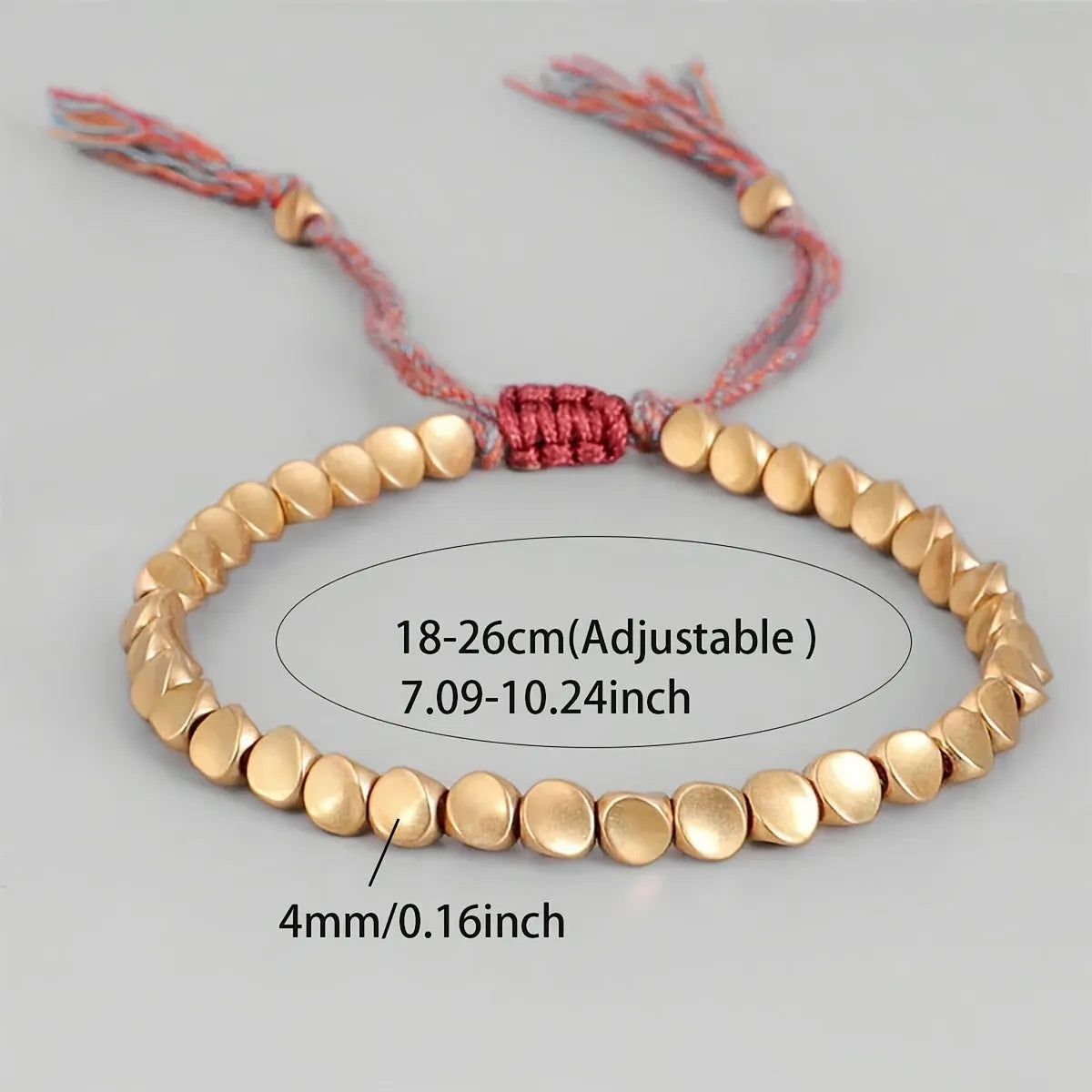 Hand-woven adjustable alloy tassel bracelet in electroplated colour T131 on neutral background