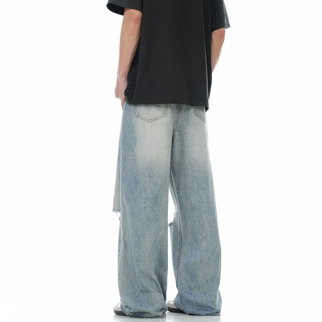 Blue straight-leg men's jeans with retro ripped detailing and zipper fly
