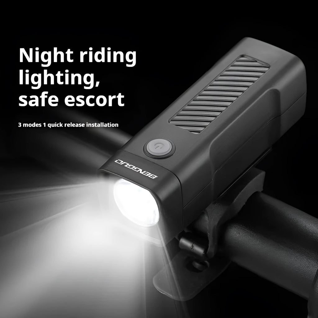 Black USB rechargeable bicycle headlight with quick release strap bracket on handlebars
